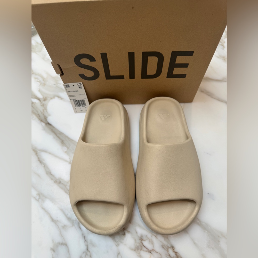 Addidas Slides. They look better in person, photos make them look dirty.